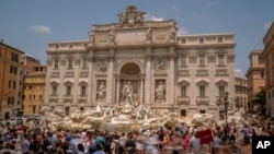 Tourists visit the Trevi Fountain in Rome, Italy, June 30, 2023.