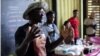 Chef Serigne Mbaye speaks to the crowd at the Afro Freedom/Afro Feast Juneteenth celebration at Grow Dat Youth Farm in New Orleans on June 19, 2023. Mbaye works to spotlight African-influenced cuisine at his New Orleans restaurant Dakar NOLA.