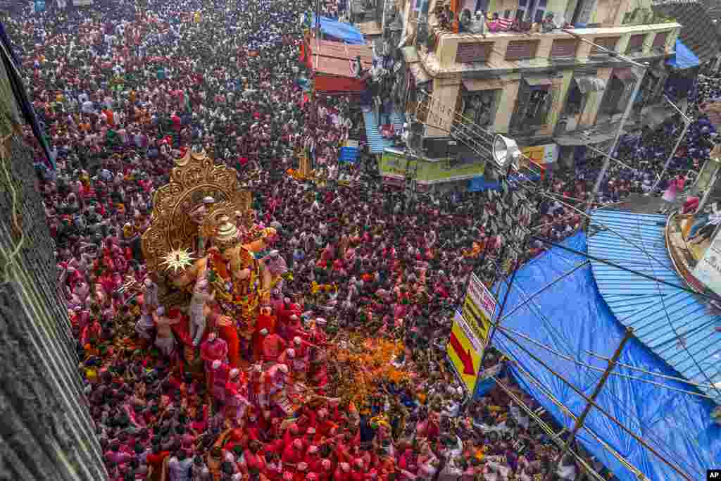 An idol of elephant-headed Hindu god Ganesha is taken for immersion on the final day of the 10-day Ganesh Chaturthi festival in Mumbai, India.