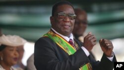 FILE - Zimbabwe President Emmerson Mnangagwa gestures during his inauguration ceremony at the National Sports Stadium in Harare, Zimbabwe, Sept. 4 2023.