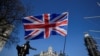 FILE - A British flag flutters in Parliament Square in London, March 29, 2019.