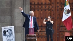 Mexican President Andres Manuel Lopez Obrador waves to supporters as he leaves after the presentation of his last government report at the El Zocalo Square in Mexico City on Sept. 1, 2024.