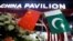FILE - Flags of Pakistan and China are seen at the entrance to the China Pavilion, during the International Defense Exhibition and Seminar "Ideas 2022" in Karachi, Pakistan, Nov. 16, 2022.