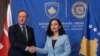 Presiden Kosovo Vjosa Osmani (kanan), menyambut Menteri Luar Negeri Inggris David Cameron di ibu kota Pristina selama kunjungan pertamanya ke Kosovo, Kamis, 4 Januari 2024. (AP Photo/Visar Kryeziu)