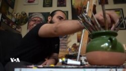 هونەرمەندێکی زاخۆ لە ڕێگەی تابلۆکانییەوە سەختی ژیانی بەشێک لە هاووڵاتیانی شارەکەی دەخاتەڕوو