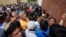 Neighbors and voters gather at a polling station after electoral authorities delayed its opening due to alleged electoral violations during general elections in San Jose El Golfo on the outskirts of Guatemala City, June 25, 2023.