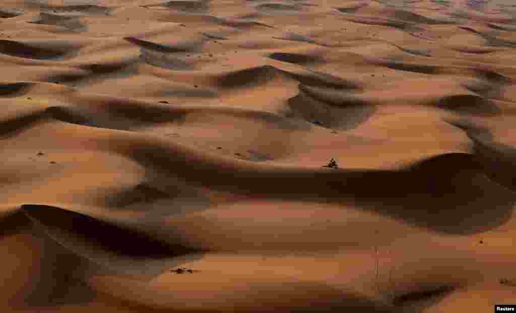 A biker competes during Stage 2 of the Dakar Rally 2024, between Al Henakiyah and Al Duwadimi, Saudi Arabia.
