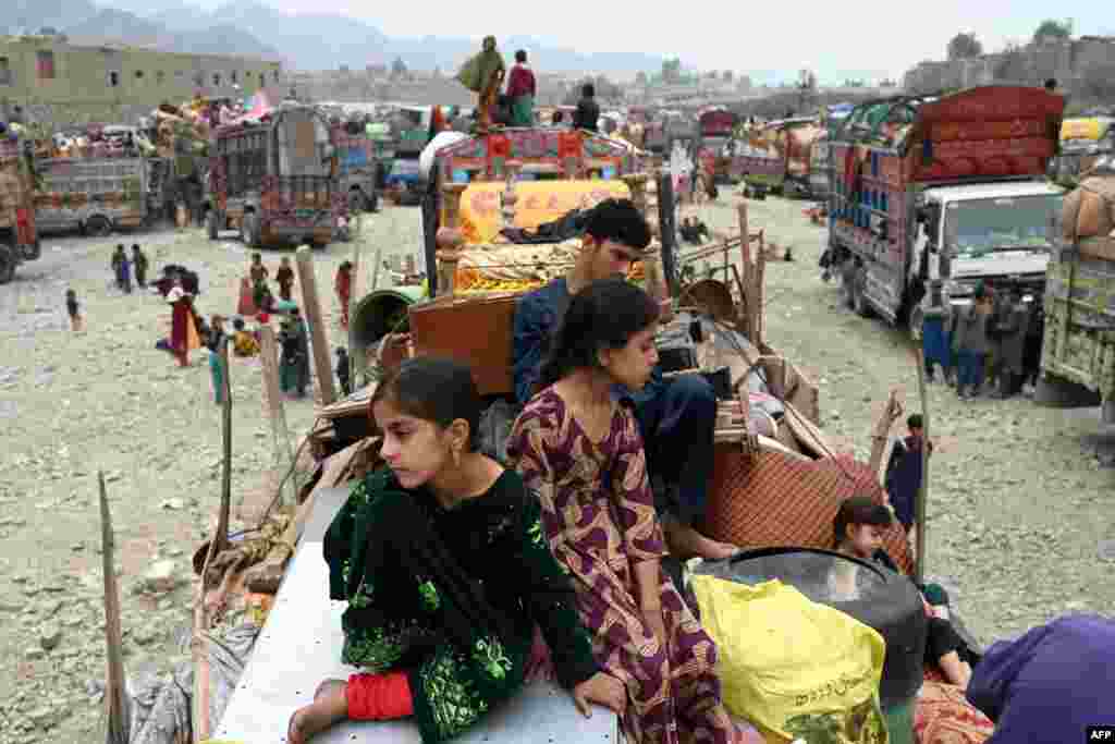 Afghan refugees arrive with their belongings on trucks from Pakistan at the Afghanistan-Pakistan Torkham border in Nangarhar province.&nbsp;Hundreds of thousands of Afghans living in Pakistan faced the threat of detention and deportation on November 1, as a government deadline for them to leave sparked a mass exodus.