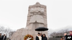 Martin Luther King III accompanied by his daughter Yolanda Renee King and his wife Andrea Waters King, pose during the Annual Martin Luther King Jr. Wreath Laying Ceremony at Martin Luther King Jr. Memorial in Washington, Jan. 15, 2024. 