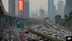 Vehicles are caught in a congestion during rush hour in Jakarta, Indonesia, on Oct. 27, 2023. Pollution is causing respiratory illnesses and deaths to rise in Indonesia's island of Java, including the capital, Jakarta. 