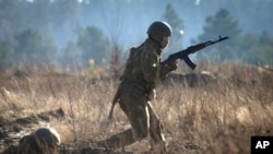 Soldiers of Ukraine's National Guard 1st brigade Bureviy (Hurricane) practice during combat training at a military training ground in Ukraine, Nov. 3, 2023.