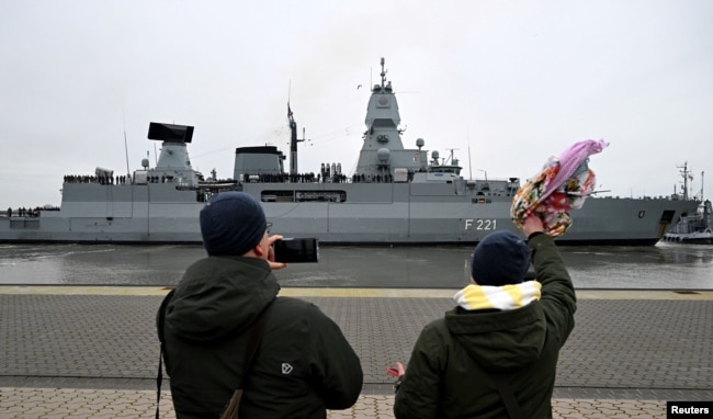 FILE - People wave and take pictures as the frigate Hessen is sent off to the Red Sea from Wilhelmshaven, Germany, Feb. 8, 2024, to participate in the international Aspides mission to protect shipping and ensure freedom of navigation in the Red Sea.