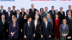 U.S. Secretary of State Antony Blinken, front center right, and North Macedonia Foreign Minister Bujar Osmani, front center left, are pictured with other officials at the Organization for Security and Cooperation in Europe meeting in Skopje, North Macedonia, Nov. 29, 2023. 