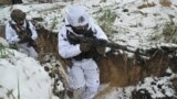 Ukrainian servicemen of the 43rd Mechanized Brigade in snow camouflage take part in a military training in an undisclosed location in the Kharkiv region on Dec. 1, 2023, amid the Russian invasion of Ukraine.