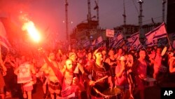 Israelis protest against plans by Prime Minister Benjamin Netanyahu's government to overhaul the judicial system in Tel Aviv, Israel, July 15, 2023.