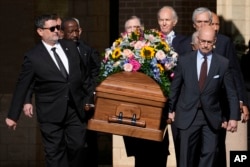 Former and current U.S. Secret Service agents carry casket of former first lady Rosalynn Carter at Phoebe Sumter Medical Center in Americus, Ga., Nov. 27, 2023.