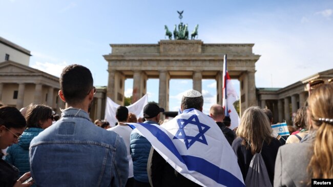 Supporters of Israel hold a solidarity rally in front of Brandenburg Gate, in Berlin, Germany, Oct. 8, 2023.