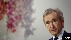 FILE - World's top luxury group LVMH head Bernard Arnault looks on during the presentation of the second part of the LVMH's sustainability plan, called Life 360, at the Maison de L'Unesco in Paris, France, Dec. 14, 2023.