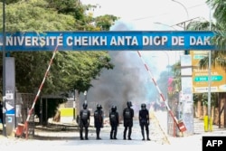 Police officers block the entrance to the Cheikh Anta Diop University, in Dakar on June 1, 2023, during unrest following the sentence of opponent Ousmane Sonko.