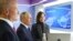 Russian President Vladimir Putin, center, and Sberbank CEO German Gref, left, visit an exhibition on artificial intelligence in Moscow, Russia, Nov. 24, 2023.