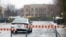 FILE - A police car patrols in a Jewish community in Montreal, Canada, March 30, 2020. A Jewish school in the city was reportedly hit by gunfire Sunday.