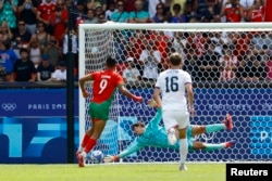 Soufiane Rahimi scores Morocco's first goal, on a penalty kick, during his team's 4-0 victory over the U.S. in an Olympic quarterfinal match at Parc de Princes in Paris, Aug. 2, 2024.