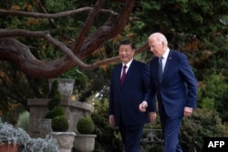 Chinese President Xi Jinping talks with U.S. President Joe Biden after meeting in Woodside, California, on Nov. 15, 2023.