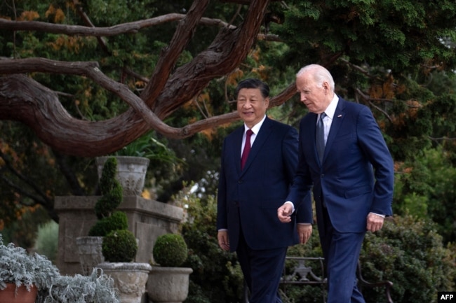 Chinese President Xi Jinping talks with U.S. President Joe Biden after meeting in Woodside, California, on Nov. 15, 2023.