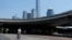 A man crosses the road near the central business district in Beijing, July 17, 2023. China's economy grew at a 6.3% annual pace in the April-June quarter, much lower than analysts had forecast given the slow pace of growth the year before. 