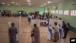 FILE - Voters cast their ballots in Diepsloot, near Johannesburg on Wednesday, May 8, 2019.