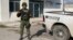 FILE - A Mexican army soldier guards the Tamaulipas State Prosecutor's headquarters in Matamoros, Mexico, March 8, 2023. Thirty-one migrants were abducted in the state Saturday.