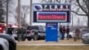 Police respond to a shooting at Perry High School in Perry, Iowa, Jan. 4, 2024. Police said a 17-year-old student killed one child and wounded five other people.