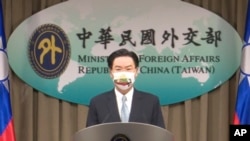FILE - In this July 20, 2021, file image taken from a video footage run by Taiwan's Ministry of Foreign Affairs, Taiwan Foreign Minister Joseph Wu, speaks about exchanging representative offices with Lithuania during a press briefing in Taipei, Taiwan.