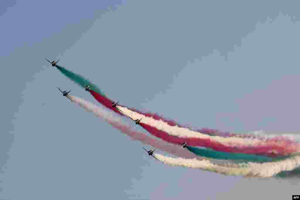 The Saudi Hawks aerobatics team performs following the first practice session of the Saudi Arabian Formula One Grand Prix at the Jeddah Corniche Circuit in Jeddah.