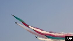 The Saudi Hawks aerobatics team performs following the first practice session of the Saudi Arabian Formula One Grand Prix at the Jeddah Corniche Circuit in Jeddah.
