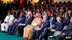 Saudi Arabia PM Mohammed Bin Salman Bin Abdulaziz Al-Saoud (C), flanked by U.N. Secretary-General Antonio Guterres (2nd R) and French President Emmanuel Macron (R) listen to speeches at the New Global Financial Pact Summit at the Palais Brongniart in Paris on June 22, 2023.