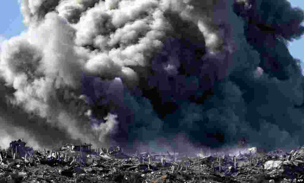 A picture taken from a position near Sderot along the Israeli border with the Gaza Strip shows smoke billowing during an Israeli bombardment on the northern Palestinian territory. (Photo by FADEL SENNA / AFP)