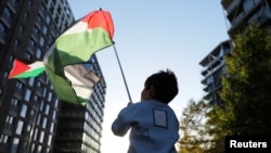 People rally in London on Saturday to show solidarity with Palestinians in Gaza during the ongoing Israel-Hamas war, Nov. 11, 2023. 