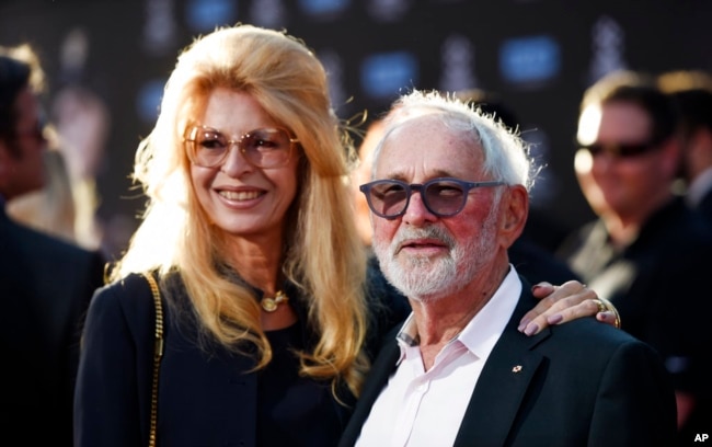 FILE - Norman Jewison, right, poses with his wife Lynne St. David at the TCL Chinese Theatre in Los Angeles, April 6, 2017.