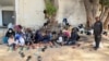 Des réfugiés du Soudan sur un sit-in du Haut Commissariat des Nations Unies pour les réfugiés (HCR) à Tripoli, le 15 juillet 2023.