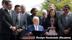 (FILE) President Joe Biden signs a proclamation to restore protections for Bears Ears and Grand Staircase-Escalante National Monument.