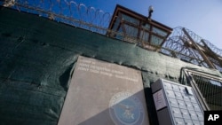 FILE - In this photo reviewed by U.S. military officials, the control tower of Camp VI detention facility is seen on April 17, 2019, in Guantanamo Bay Naval Base, Cuba.