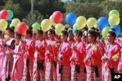 Ethnic Shan artists perform during a ceremony to mark the 8th anniversary of the Nationwide Ceasefire Agreement (NCA) at the Myanmar International Convention Center in Naypyitaw, Myanmar, Oct. 15, 2023.