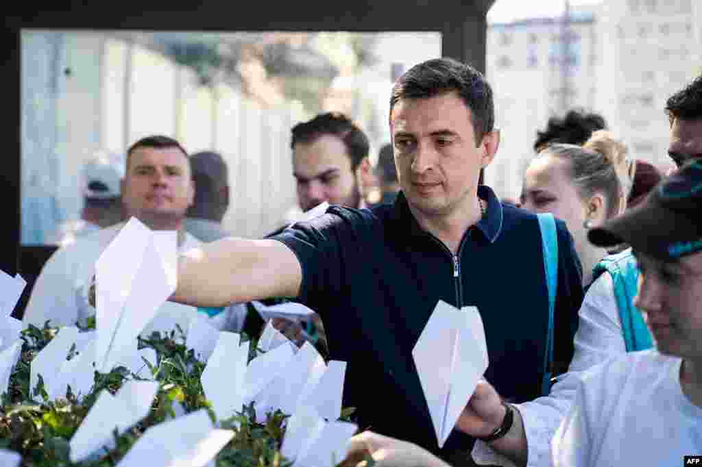 This handout photograph posted on the official Telegram channel of the Vice Speaker of the State Duma from the &quot;New People&quot; party, Andrei Davankov, shows party supporters displaying paper planes as a reference to the logo of Telegram outside France&#39;s Embassy in central Moscow, in support of Pavel Durov, founder and CEO of the messaging app.&nbsp; Dirov was arrested earlier at the Le Bourget Paris airport, France, for offences related to his popular messaging app