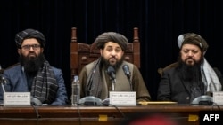 FILE - Taliban acting Defense Minister Mohammad Yaqoob Mujahid, center, speaks at a press conference in Kabul, Afghanistan, Dec. 31, 2023. 