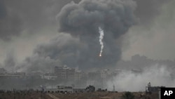 Smoke rises following an Israeli airstrike in the Gaza Strip, as seen from southern Israel, Nov. 22, 2023.