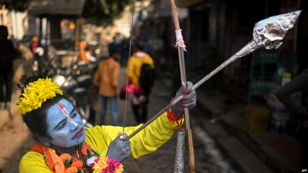 A devotee dressed as Hindu deity Lord Ram, poses for a picture in Ayodhya, India, on Jan. 22, 2024. India's Prime Minister Narendra Modi inaugurated a temple that embodies the triumph of his muscular Hindu nationalist politics.