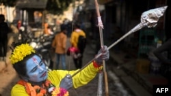 A devotee dressed as Hindu deity Lord Ram, poses for a picture in Ayodhya, India, on Jan. 22, 2024. India's Prime Minister Narendra Modi inaugurated a temple that embodies the triumph of his muscular Hindu nationalist politics.