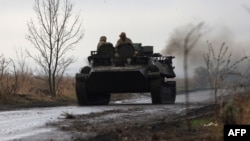 A Ukrainian armored vehicle rides on a road not far from the front line in Donetsk region on Nov. 16, 2023, amid the Russian invasion of Ukraine.