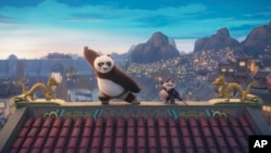 This image released by Universal Pictures shows characters Po, voiced by Jack Black, left, and Zhen, voiced by Awkwafina, in a scene from DreamWorks Animation's "Kung Fu Panda 4." (DreamWorks Animation/Universal Pictures via AP)